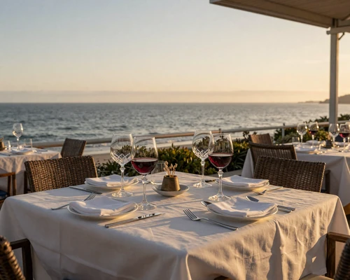 Elegant oceanfront dining table at sunset overlooking the Pacific in San Diego