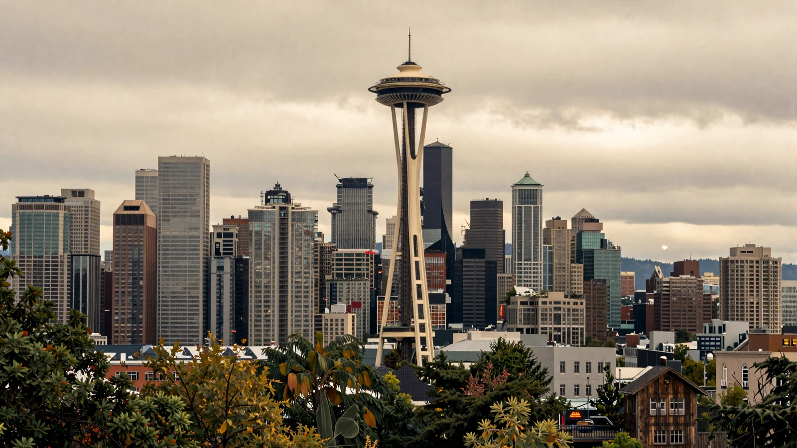 Seattle skyline with Space Needle and Olympic Mountains at golden hour